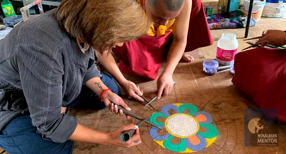 Clients are making Sand Mandala in the supervision & guidance of expert monks 